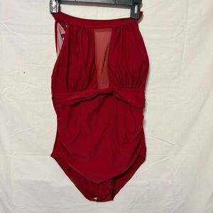 red high-neck one-piece swimsuit featuring a ruched waist and a mesh inset.